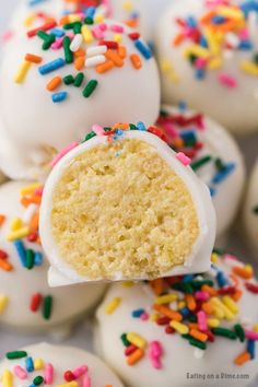 white cake truffles with sprinkles on them