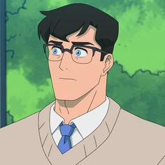 a man wearing glasses and a sweater with a blue tie is staring at the camera