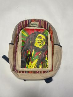 With our excellent Timmur Multicolor Bob Printed Hemp Backpack For Men & Women, discover the ultimate level of sustainability and style. This bag is made from high-quality organic hemp fibers, which adds to its natural appeal and helps the environment. **HAND LOOMED BY WOMEN IN NEPAL** Specifications 70% cotton and 30% hemp fibers made in Nepal Handmade products with a quality print Durable and Eco-friendly Highest quality material Versatile outlook for any occasions Safe and secure with reliable zipper closure Shipping and Return Fast and Reliable Delivery within 3-5 business days Secure Packaging Quality Assurance A hassle-free replacement within 7 days for incorrect or damaged shipments Non-Refundable Eco-friendly Outdoor Backpack, Eco-friendly Bags For Back To School Travel, Eco-friendly Travel Bags For Back To School, Casual Bags For Back To School Trip, Casual Back-to-school Bags For Trips, Casual Back To School Trip Bag, Bob Marley Print, Hemp Backpack, Help The Environment