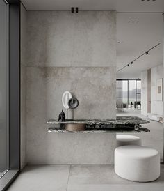 a bathroom with a sink, mirror and stool next to a large glass window in the wall