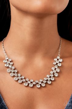 a woman wearing a silver necklace with crystal stones on the front and back of her neck