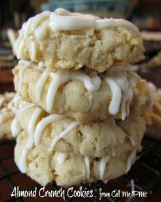 three cookies with white icing stacked on top of each other