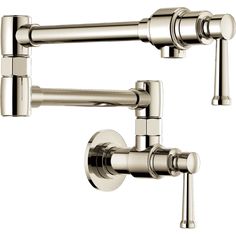 two chrome faucets with handles on each side and one arm in the middle