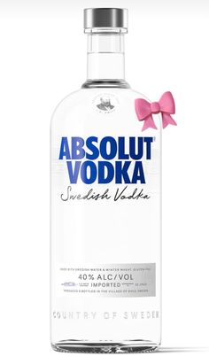 a bottle of vodka with a pink bow on the top and an ad for absolut vodka