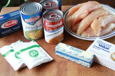 some food is sitting on a table with milk, butter, and other things to eat