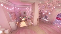 a room with pink walls and lights on the ceiling is decorated in pastel colors