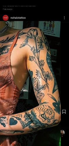 a woman with tattoos on her arm and shoulder