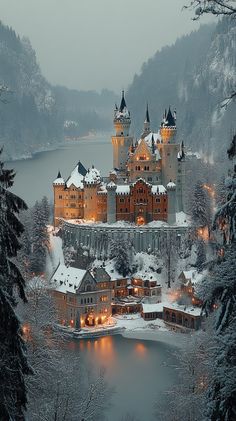 a castle is lit up in the snow