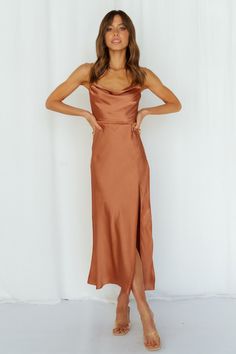 Length from shoulder to hem of size S: 103cm. Rust midi dress. Lined. Cold hand wash only. Model is a standard XS and is wearing XS. True to size. Lightweight, woven satin fabric. Invisible back zipper. Polyester. With this cute AF satin midi, you'll be hypnotizing everyone in the room. Get ready to hear about everyone's desires. The Stand On My Own Midi Dress has a lovely open back, with a straight neckline and boning at the torso. Style yours with strappy heels and gold adornments. Dress Date Night, Midi Dress Formal, Dress Stand, Denpasar, Rust Dress, On My Own, Dress Satin, Satin Midi Dress, Dress Formal