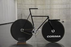 a black bike with the word cormi written on it