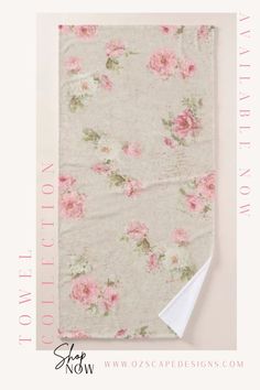 a white towel with pink flowers on it