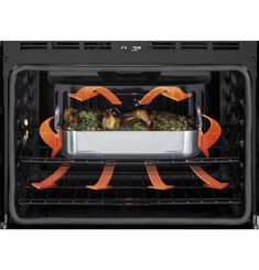 an open oven with food in it and orange ribbons on the racks to keep them warm