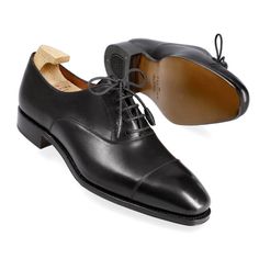 WOMEN'S OXFORDS IN BLACK VITELLO Classic Cap Toe Oxfords For Galas, Classic Oxfords With Rubber Sole For Galas, Classic Oxford Shoes With Leather Sole, Classic Black Cap Toe Lace-up Shoes, Classic Black Lace-up Oxfords, Classic Cap Toe Lace-up Shoes For Galas, Timeless Black Oxfords With Round Toe, Timeless Black Almond Toe Oxfords, Cap Toe Oxfords With Rubber Heel Cap For Galas