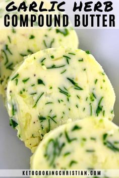 three pieces of garlic herb compound butter on a white plate with the title above it