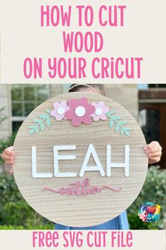 a woman holding up a sign that says, how to cut wood on your cricut