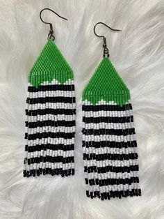 green, white and black beaded earrings