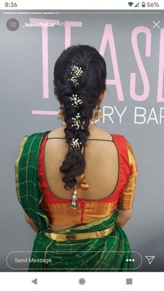 the back of a woman's head with braids in her hair