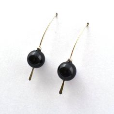 "These are my go-to earrings!  The classic shape makes them easy to wear and they look great dressed up or down.  The black swarovski crystal pearl is a wonderful contrast with the hammered silver. These earrings are about 1 1/2\" long and will come in a gift box ready for giving. Love your purchase from Louise Barker?  I would love to see you in it!  Post a photo of yourself wearing it to Instagram and tag me @louisebarkerdesigns.  Direct message me for a discount on your next Etsy purchase! Th Elegant Adjustable Earrings With Lever Back Ear Wires, Black Pearl Drop Earrings For Formal Occasions, Black Pearl Drop Earrings For Formal Events, Elegant Black Pearl Earrings, Elegant Black French Hook Earrings, Black Pearl Drop Earrings For Evening, Black Dangle Pearl Earrings For Formal Occasions, Classic Black Pearl Earrings, Elegant Wire Wrapped Earrings For Everyday