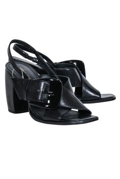 These Tory Burch heels are the perfect combination of chic and playful, with sleek leather and bold crisscross straps. The slingback style features a chunky stacked banana heel and an oversized buckle, adding a touch of quirkiness. Step out in style with these polished pumps! Size 8 Leather upper, lining & sole Slingback strap w/ elastic Crisscross straps Oversized buckle Chunky stacked heel Heel height 3.75" Chic Strappy Heels With Buckle Closure, Leather Strappy Heels With 4-inch Heel, Leather Strappy Sandals With Stacked Heel, Black Strappy Slingback Pumps With Heel Strap, Leather Strappy Heels With Stacked Heel, Chic Heels With Buckle Closure And Medium Width, Chic Black Strappy Slingback Pumps, Black High Heel Slingback Sandals With Buckle, Trendy Leather Block Heel Slingback Sandals