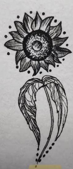 an ink drawing of a sunflower on a piece of paper