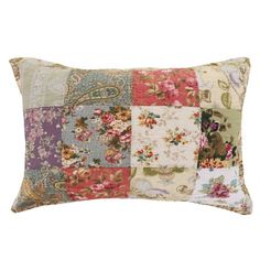 a multicolored patchwork pillow on a white background