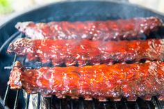 bbq ribs cooking on the grill with ketchup