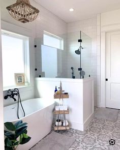 a white bath tub sitting next to a window