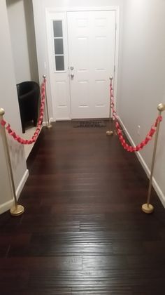 a room that has some red rope on the floor