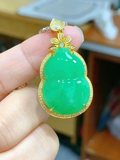 This listing is for a rare, apple green jade pendant. It is made of natural, type A jadeite. The setting is made of 18K solid yellow gold and natural diamonds. --DETAILS-- Grade: Natural, untreated, type A Jade type: Jadeite Color: Green (apple) Degree of translucency: MEDIUM-HIGH Jadeite stone condition: No cracks or other imperfections Jade gourd size: 24.8x17.8mm / Total size: 39.2x20.9x9.6mm Item SKU: PPY-0098 --CERTIFICATION-- This process takes about 5-7 days depending on the Gem Testing L Exquisite Green Jade Jewelry, Lucky Stone, Apple Green, Jade Pendant, Green Jade, Green Apple, Jade Green, Stone Pendant, Solid Yellow