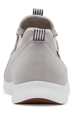 Show off sporty style in this lightweight mesh slip-on sneaker constructed with lace-up ties, front and back pull tabs and a white rubber sole. Textile and synthetic upper/textile lining/rubber sole Imported Sporty Slip-on Sneakers With Elastic Laces For Light Sports, Casual Mesh Slip-on Sneakers With Elastic Laces, Slip-on Low-top Textile Walking Shoes, Slip-on Low-top Nylon Sneakers, Slip-on Nylon Low-top Sneakers, Gray Low-top Mesh Slip-on Sneakers, Breathable Leather Low-top Slip-on Sneakers, Sporty Low-top Slip-on Nylon Sneakers, Sporty Low-top Nylon Slip-on Sneakers