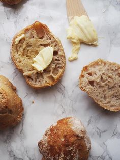 some bread and butter on a marble surface