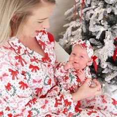 Perfect for snuggling up by the fire with a warm cup of cocoa, this adult pajama set with a girly Christmas bow design is sure to bring some festive fun to your holiday season! This long sleeve pajama set with a button-up shirt will be extra cozy for mom, and has a classy collar to elevate your family matching look to make for the cutest Christmas card photos. Made from soft bamboo, these pajamas will keep you cozy throughout every winter wonderland, and were made for family matching fun. Whether you're watching your little ones open presents on Christmas morning or chestnuts roast by the open fire, these plaid PJs are the cozy outfit you've been looking for for a magical holiday season! Women's Pajama Set Details: 95% Bamboo Viscose | 5% Spandex Extra length & pockets for extra comfort In Plaid Pjs, Two Piece Pajama Set, Cup Of Cocoa, Girly Christmas, Personalized Swaddle, Girls Nightgown, Newborn Accessories, Personalized Sweater, Adult Pajamas