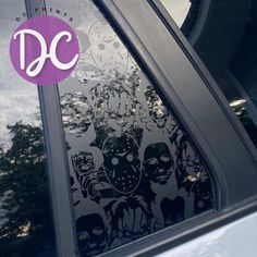 the decal on this car says dc and it's in front of a window