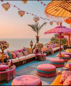 an outdoor seating area with pink and yellow furniture