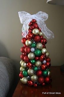 a christmas tree made out of ornaments on a table