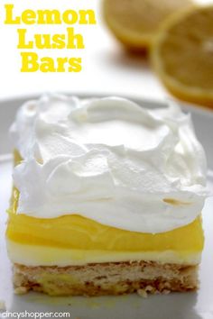 the lemon lush bars are topped with whipped cream