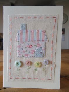 a handmade card with buttons on it