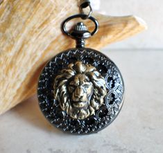 Bronze lion pocket watch, mechanical pocket watch in black. #Uniquehandmadegifts #holidaygift #handmade #charsfavoritethings #jewelry Tywin Lannister, Large Locket, Saint Helens, Mechanical Pocket Watch, Unique Handcrafted Jewelry, Assemblage Jewelry, Pendant Watches, Watch Display, Gadgets To Buy