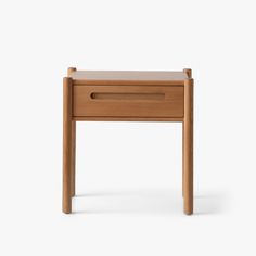 a small wooden table with one drawer open