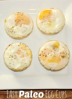 four fried eggs sitting on top of a white plate with the words easy egg cups