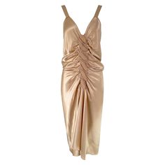 John Galliano, old Hollywood glamourous gold satin evening dress with a plunge V neckline and chiffon woven shirred center front, The back features a row of working self buttons & loops. Amazing dress of silky satin the design has a touch of the 1930s. Some scattered marks inside, which are not seen from the outside. Marked size 6. The label is missing, the size & content tag are present. Guaranteed authentic. In excellent wearable condition. All our clothing is dry cleaned and inspected for con