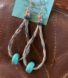 Hand-made horse hair loop earrings accented with turquoise dyed leather coed and turquoise beads. Braided loops are 2" long. Hair Loop, Turquoise Leather, Earring Ideas, Loop Earrings, Horse Hair, Jewelry Earrings Hoops, Turquoise Beads, Leather Cord, Beading