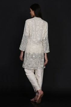 Ivory jacket with floral vine motifs in gara, resham and sequinwork embroidery. Comes with flared pant. - Aza Fashions Elegant Cream Nehru Jacket With Long Sleeves, Elegant Off White Nehru Jacket With Chikankari Embroidery, Elegant Outerwear With Chikankari Embroidery For Reception, Elegant Off-white Nehru Jacket With Chikankari Embroidery, White Long Sleeve Bandhgala With Pearl Embroidery, Elegant Long Sleeve Bandhgala For Spring, Elegant White Long Sleeve Bandhgala, Elegant Nehru Jacket With Floral Embroidery, Elegant Cream Bandhgala With Floral Embroidery