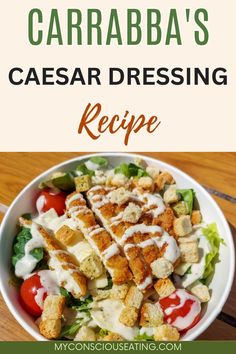 a white bowl filled with salad and dressing on top of a wooden table next to the words, caraba's caesar dressing recipe