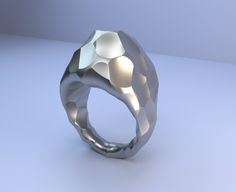 a silver ring sitting on top of a table