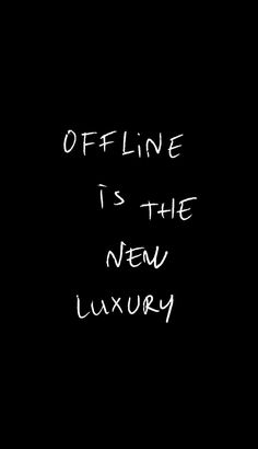 the words offline is the new luxury written in white ink on a black background