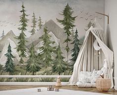 a bedroom with trees painted on the wall and a canopy bed in front of it