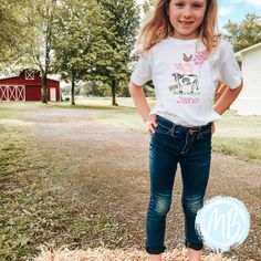 "Get ready to make some farm friends with this adorable toddler and youth tee! Featuring a playful chicken, cow, and pig, surrounded by hearts, this shirt is sure to be a hit with your little one. Perfect for any adventure, whether on the farm or in the city. Don't be chicken, add this tee to your child's wardrobe today!" Fabric & Care: Machine wash warm or cold with mild detergent Dry on normal dryer settings Do not dry clean Do not iron over design. If ironing is needed iron on low heat with g Cute Cotton T-shirt With Cow Print, Spring Cow Print Short Sleeve Top, Cute Short Sleeve Cow Print T-shirt, Cute Cow Print Short Sleeve T-shirt, Cute Cow Print Cotton T-shirt, Spring Toddler, Friends Tee, Girls Valentines, Red Tee