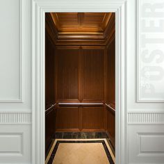 an open door with the words elevator lights on it in front of a white wall