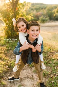 two young children are posing for the camera